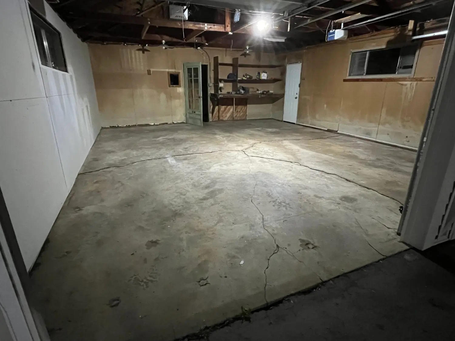 Polyaspartic Flooring in Cook County - IL being applied across a residential garage floor with decorative flakes